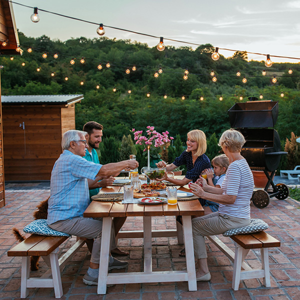 Multi generational family enjoying outdoor dining